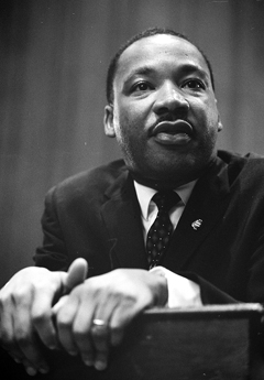 Martin Luther King 1964 leaning on a lectern